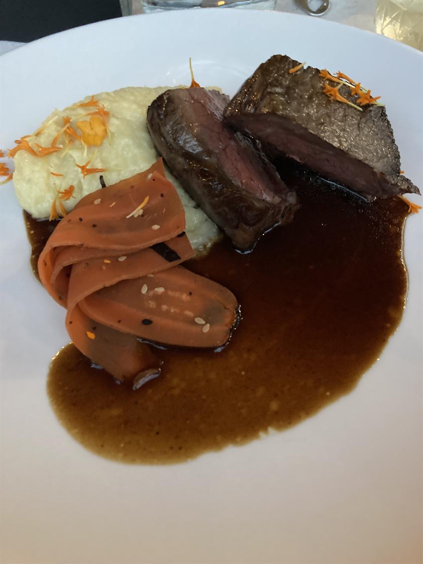 A plated entrée at a farm-to-table dinner